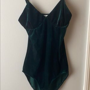Velvet emerald green bodysuit.